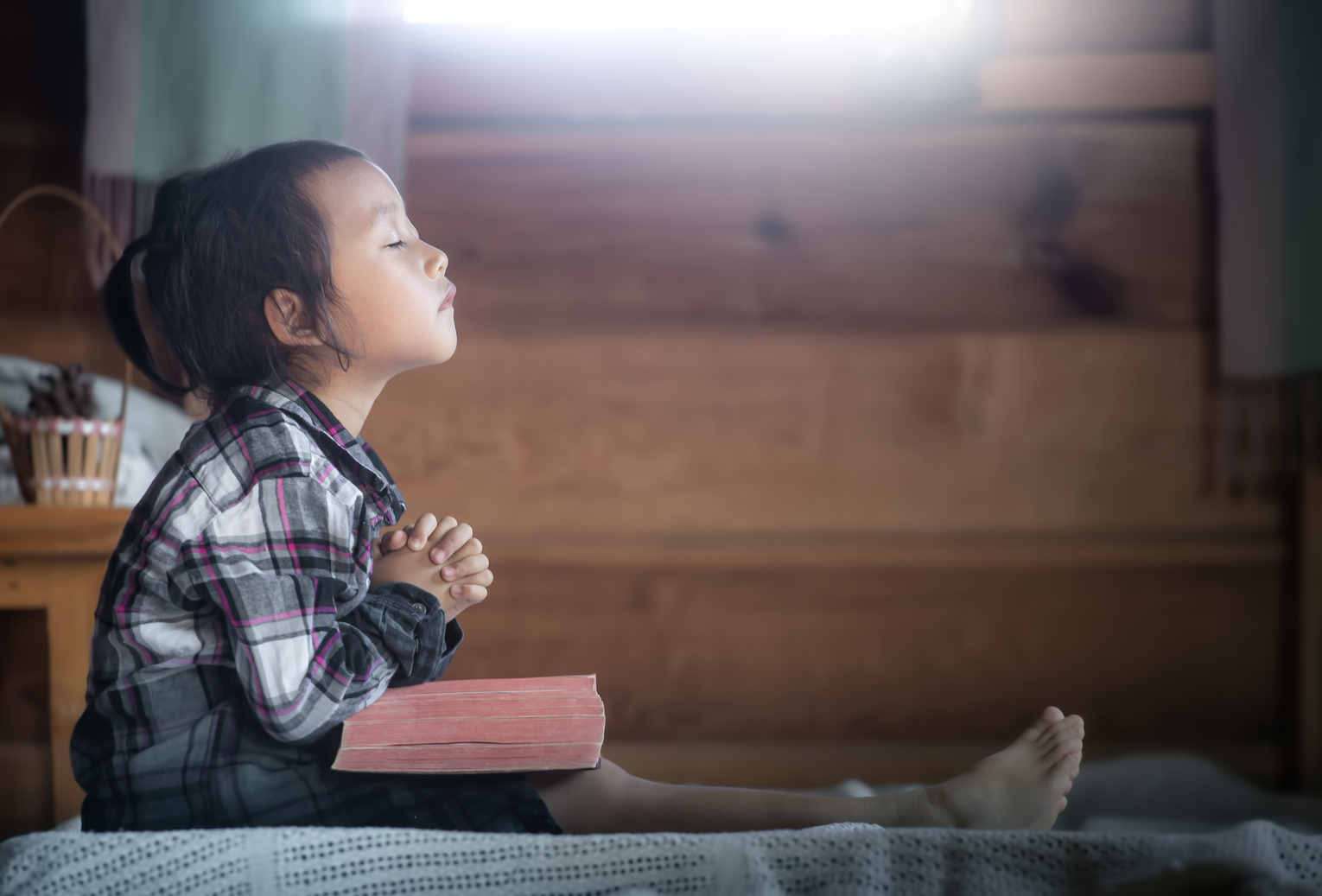 Little Girl Reading the Bible and Praying 